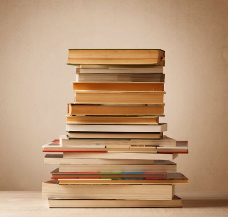 A stack of old books with vintage background