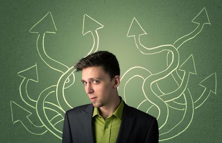 Young Businessman with thoughtful expression with tangled arrows coming out of his back