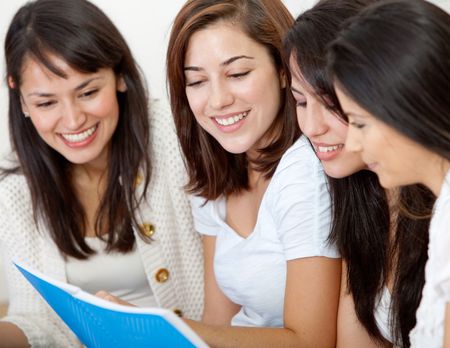 Group of girls studying at home with a notebook