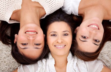Group of women lying on the floor and smiling