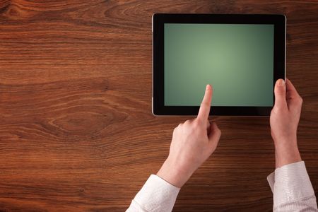 Caucasian business hands holding and working on plain tablet