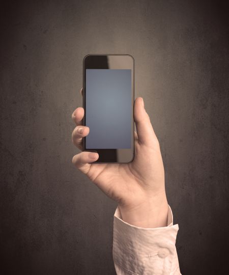 caucasian-hand-business-suit-holding-blank-653365246 Caucasian hand in business suit holding a blank screen smartphone