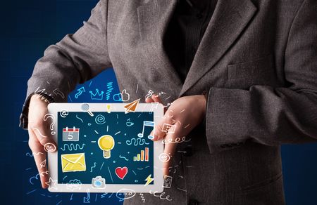 Casual businessman holding tablet with colorful apps 