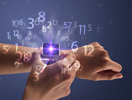 Close up female naked hand wearing smartwatch and numbers around