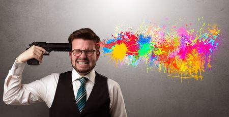 Man shoots his head with gun and colorful splotch are coming out from his head