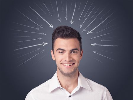 Young casual businessman with arrows pointing to his head