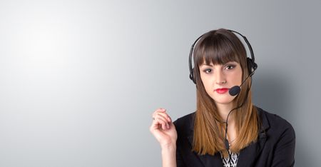 Young female telemarketer on a white background