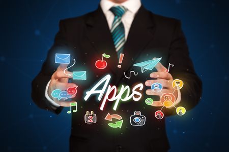 Businessman with drawn application icons and symbols in his hands 