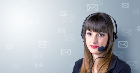 Young female telemarketer with white envelopes surrounding her 