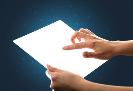 Young female hand holding and touching a piece of glass meant to look like a tablet