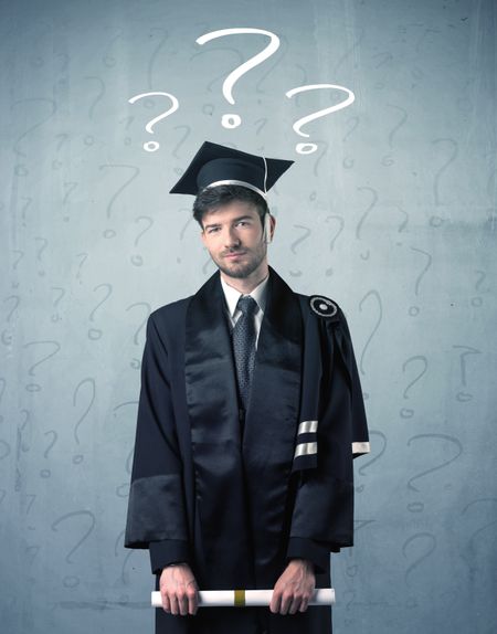 Young graduate teenager with question marks drawn over his head