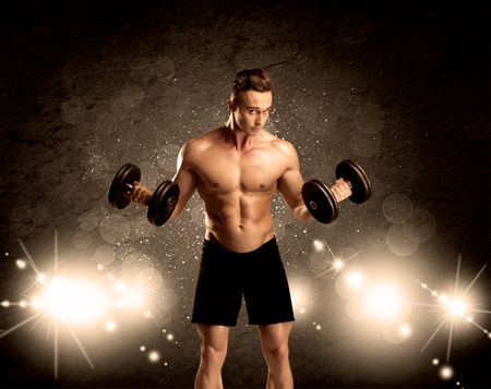 An attractive muscular guy working out with weights and showing naked upper body with illustrated lights and bokeh concept