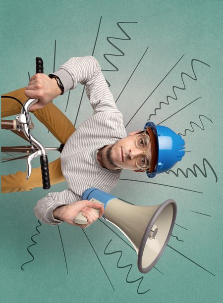 Extreme young cyclist with doodle on the background