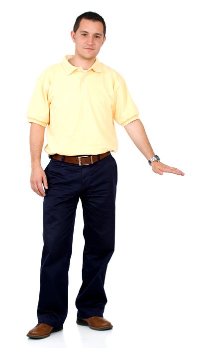 Casual friendly man in yellow and blue standing displaying something – isolated over a white background
