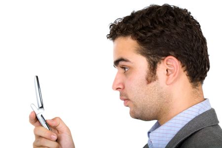 Business man on the phone dialling or sending an sms text - isolated over a white background