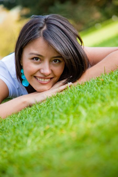 Casual woman lying on the floor outdoors