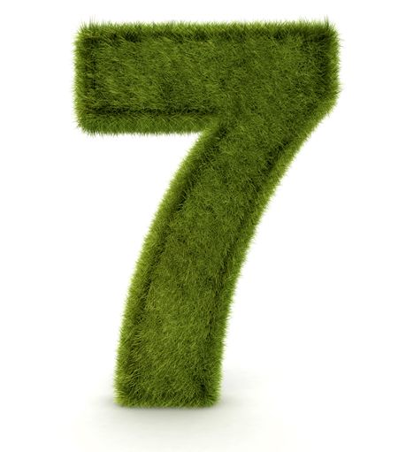 Number seven in 3D and grass texture - isolated over white