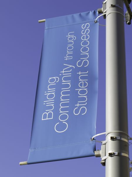 Motivational banner on campus of community college: Building Community through Student Success
