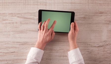 Caucasian business hands holding and working on plain tablet