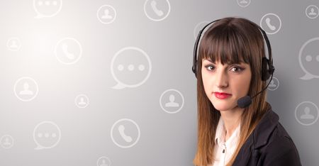 Young female telemarketer with white speech bubbles around her