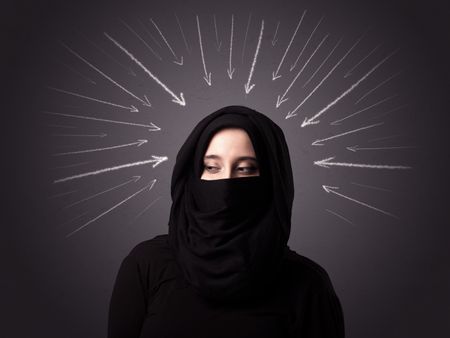Young muslim woman wearing niqab with white arrows pointing to her head 