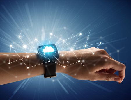 Close up female hand with smartwatch and with cloudy and connection icons around