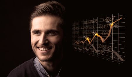 Elegant Businessman with Line Graphs and Statistics