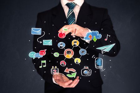 Colorful hand-drawn social media icons in the hands of a businessman 