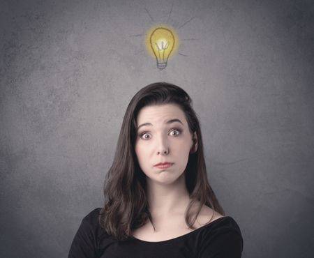 teen-student-girl-funny-facial-expression-662837176 A teen student girl with funny facial expression has a good idea illustrated by a drawn light bulb lighting up above the head on the grey wall background concept.