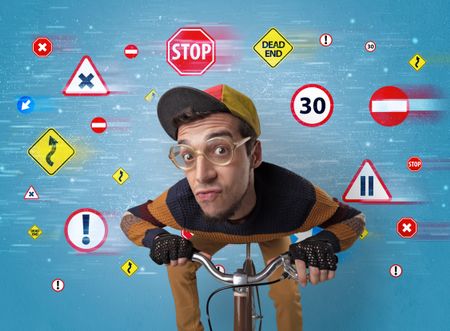 Young guy with stylish outlook and highway code on the background