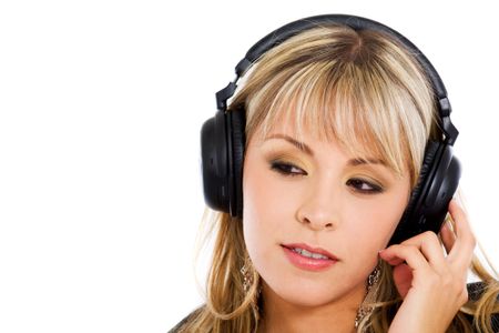 blond girl listening to music on her noise cancelling headphones isolated over a white background