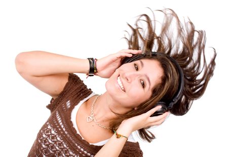 girl dancing with the music on her personal stereo isolated over a white background