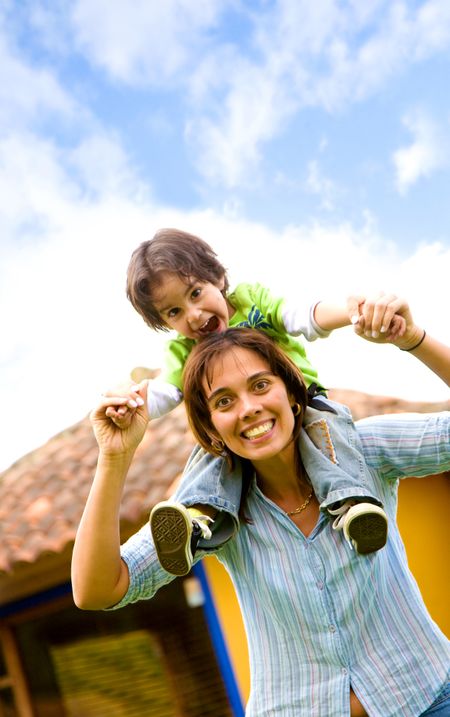 mother and son having fun portrait at home outdoors