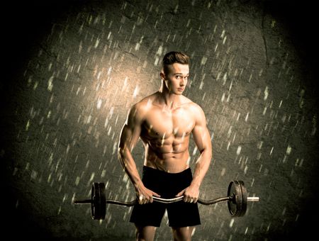 handsome-young-body-builder-weightlifting-showing-666116128 A handsome young body builder weightlifting while showing his muscular upper body in the rain concept
