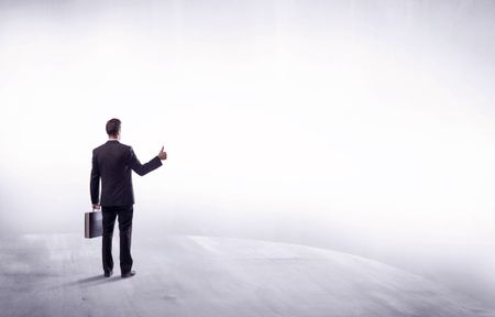 Young sales businessman in elegant suit standing with his back in empty white space background concept