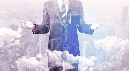 Business man standing at city overlay view background 