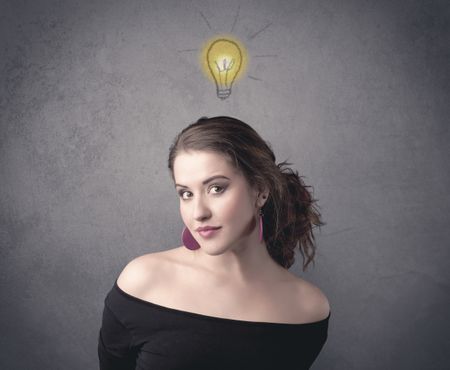 teen-student-girl-funny-facial-expression-666137515 A teen student girl with funny facial expression has a good idea illustrated by a drawn light bulb lighting up above the head on the grey wall background concept.