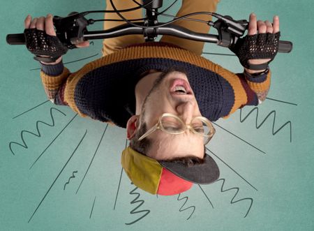 Extreme young cyclist with doodle on the background