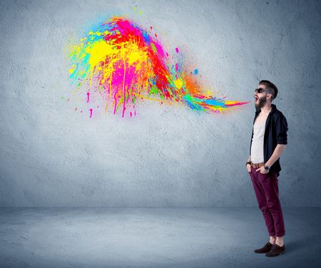 funny-hipster-person-casual-urban-clothing-667144096 A funny hipster person in casual urban clothing shouting bright colorful paint on city wall concept