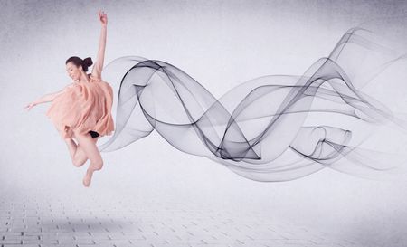 Modern ballet dancer performing with abstract swirl concept on background