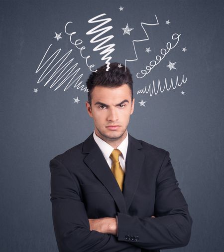 Young businessman with white scribbles around his head