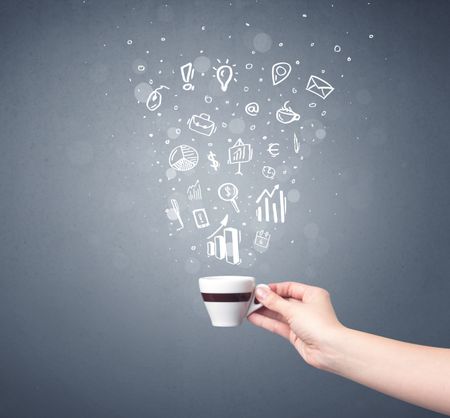 Young female hand holding coffee cup with business related drawings above it 