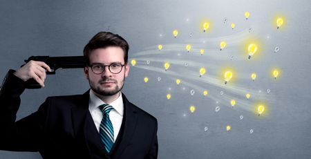 Man shoots his head with gun and idea bulbs are coming out from his head