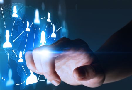 Female finger touching a beam of light surrounded by portraits and a world map behind it