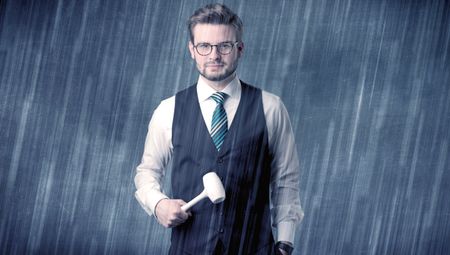 Young handsome  man holding tool with raindrop graphic