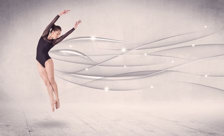 Ballet dancer performing modern dance with abstract lines concept on background