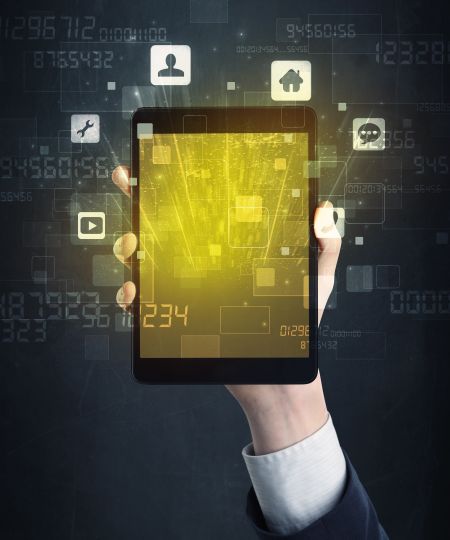 Caucasian hand in business suit holding a smartphone with golden-yellow holographic screen