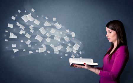 Casual young woman holding book with pages flying out of it