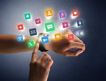 Naked female hand with smartwatch and  application labels around and dark background