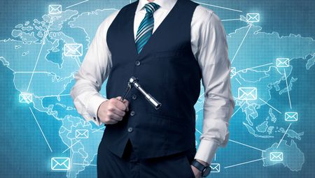 Businessman holding tool with global map graphic on the background